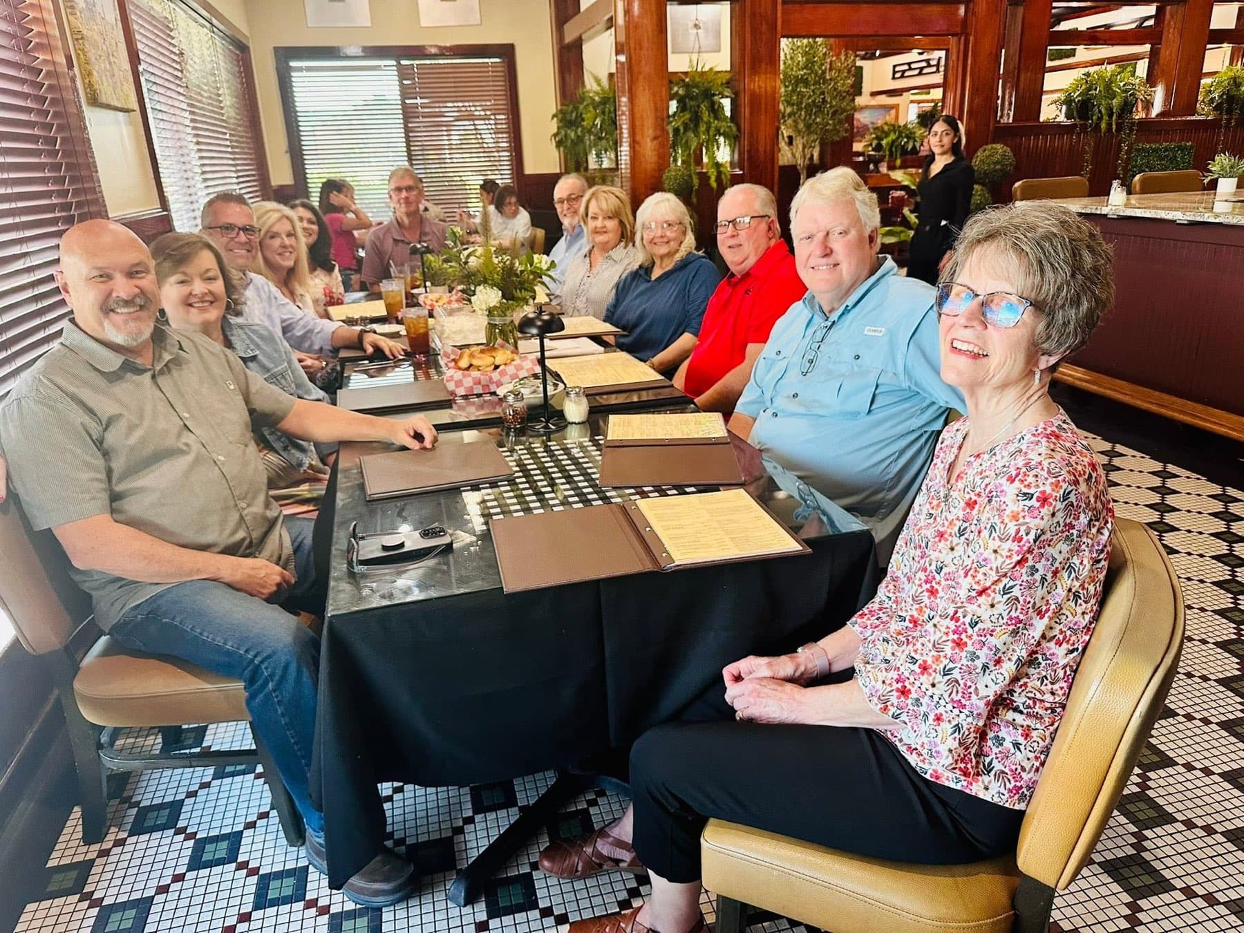 A family filling a long table