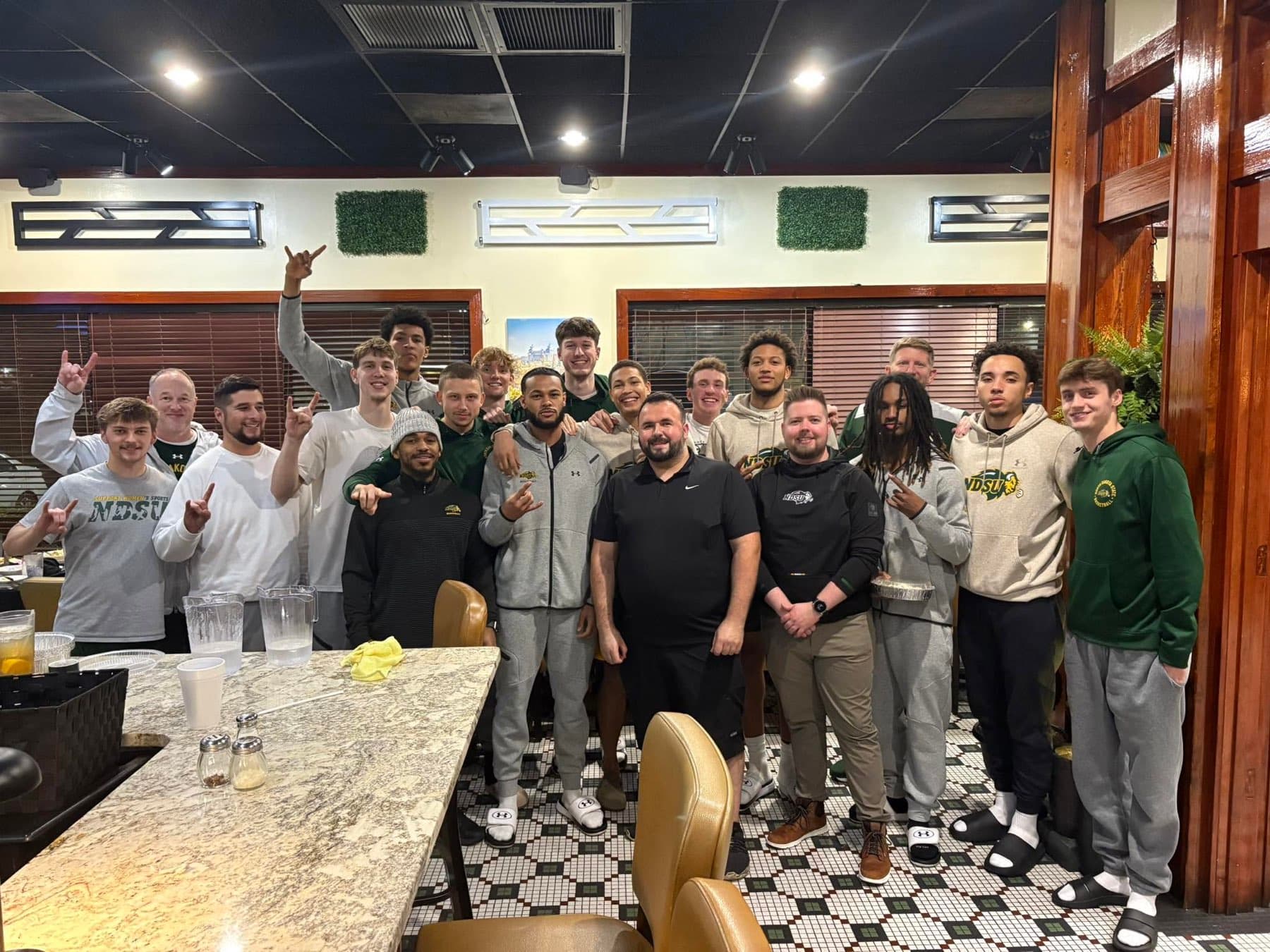 A team gathered for dinner in the dining room